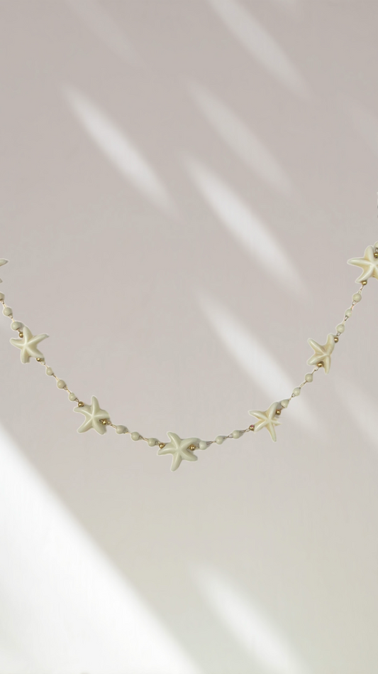 Collier étoiles blanches